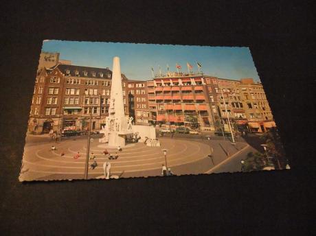 Nationaal Monument op de Dam Amsterdam,met zicht op Hotel Krasnapolsky en de Bijenkorf  1963